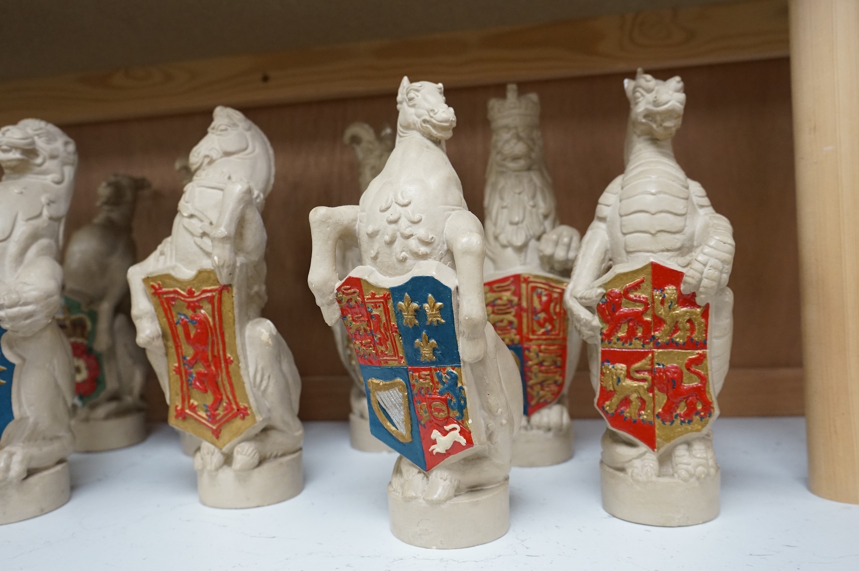 James Woodford, ten painted plaster figures of the Queen's Beasts, inscribed and dated 1953, 26cm high